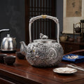 Pure 999 Fine Silver Elaborate Hand-Carved Silver Teapot with Majestic Dragon Motif and Ornate High Handle - Handicraft