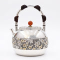 Pure 999 Fine Silver Elegant Hammered Silver Teapot with Intricate Floral Relief and Woven Handle - Handicraft