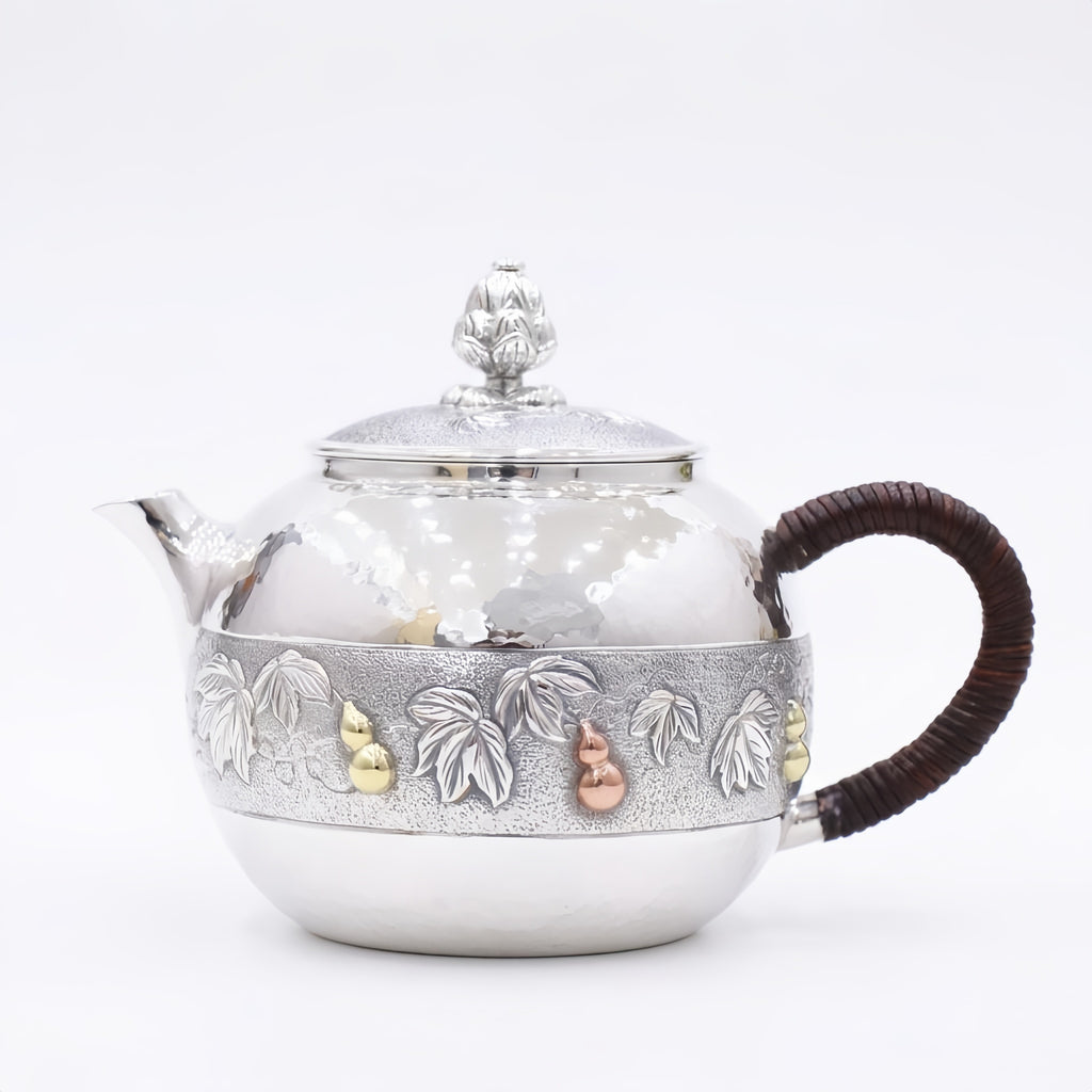Pure 999 Fine Silver Handcrafted Silver Teapot with Embossed Leaf and Gourd Motifs and Woven Handle - Handicraft