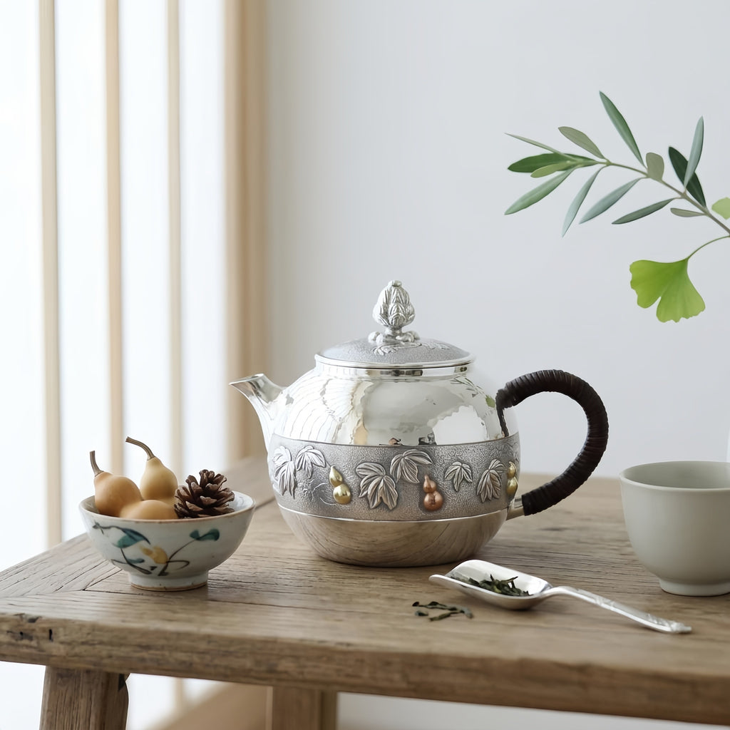 Pure 999 Fine Silver Handcrafted Silver Teapot with Embossed Leaf and Gourd Motifs and Woven Handle - Handicraft