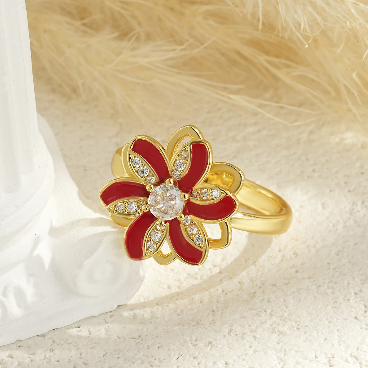 Drehbarer blumenförmiger vergoldeter Ring