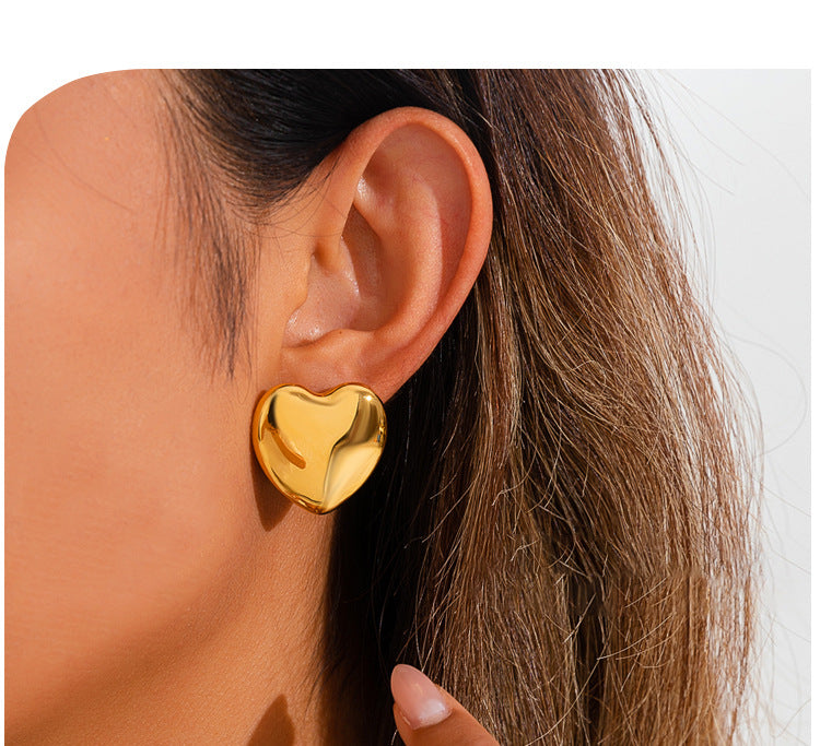 European And American Minimalist Glossy Heart-shaped Stainless Steel Earrings For Women. Light Luxury Minimalist Style. Exaggerated Heart-shaped Earrings. Versatile Accessories.