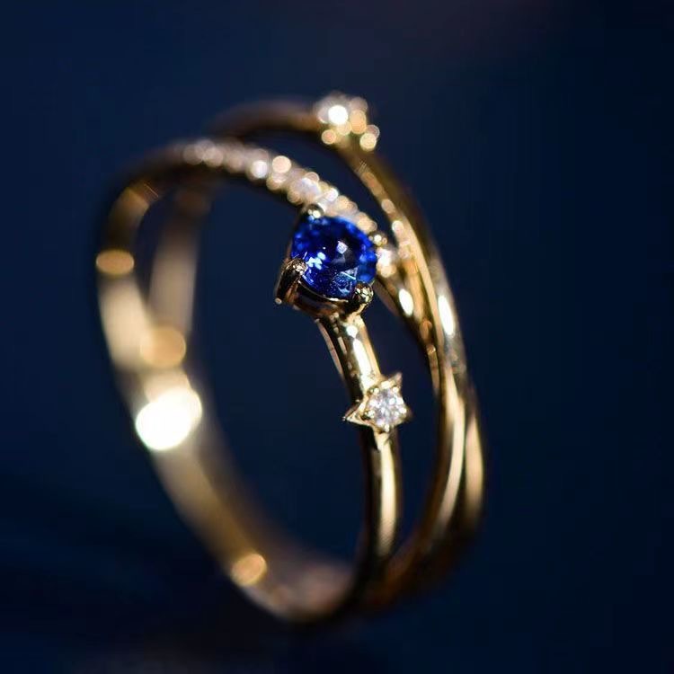 Blue Crystal Ring With Three Rows Of Diamonds
