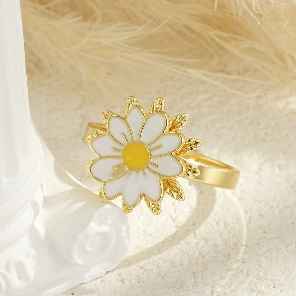 Drehbarer blumenförmiger vergoldeter Ring