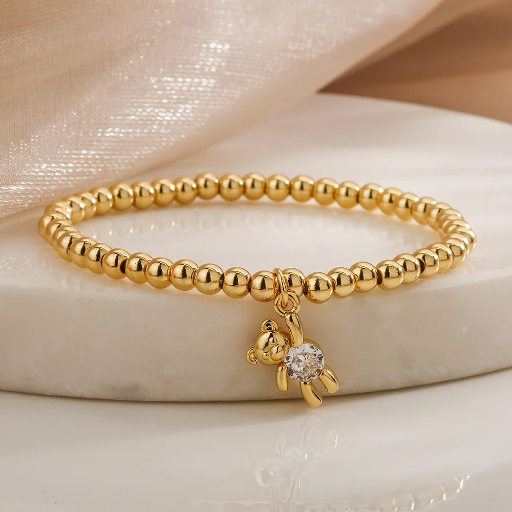 NEWBUY Trendige Goldfarbene Kupferperlen Armbänder für Frauen Weiß/Rosa/Lila Zirkonia Süße Bär Schmuck