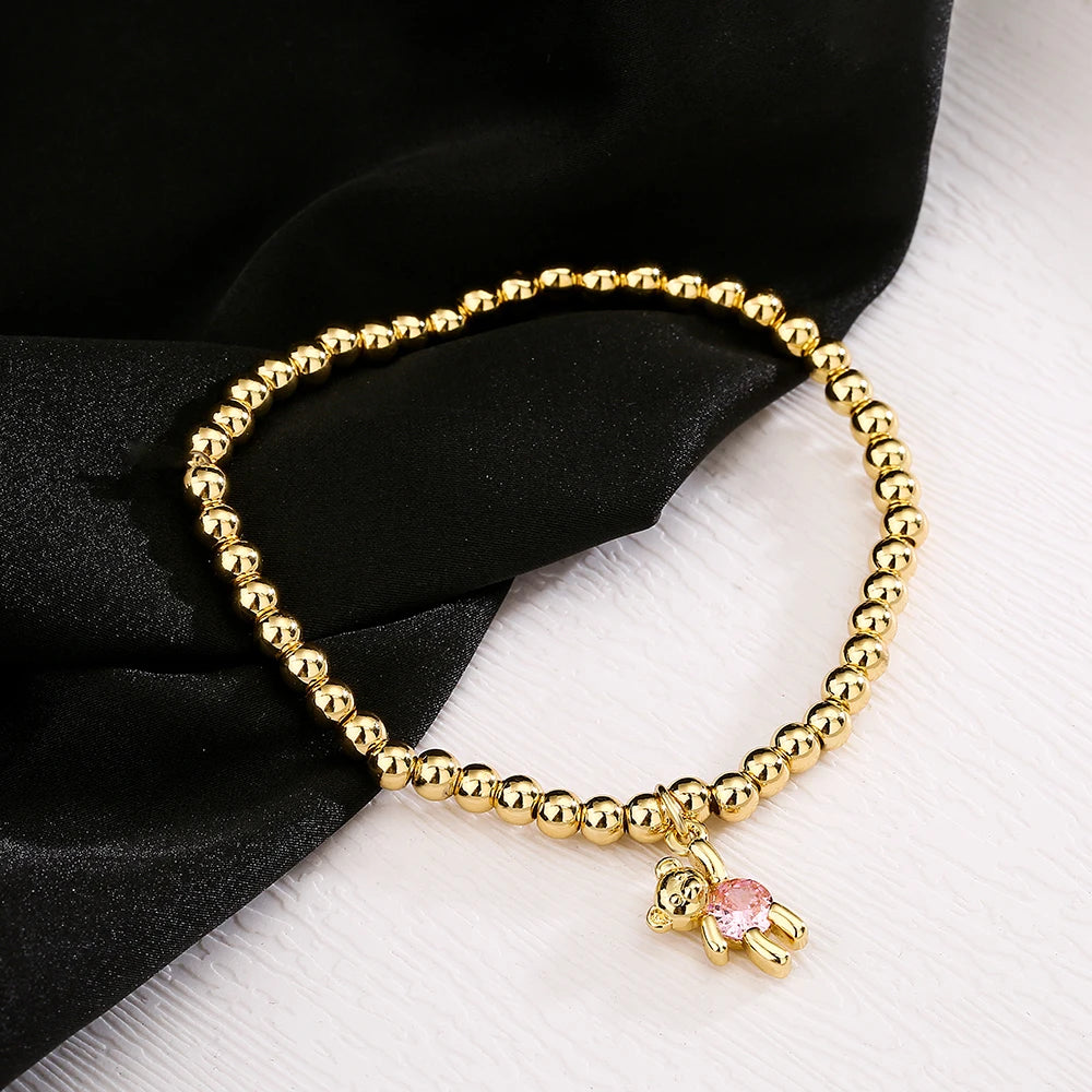 NEWBUY Trendige Goldfarbene Kupferperlen Armbänder für Frauen Weiß/Rosa/Lila Zirkonia Süße Bär Schmuck