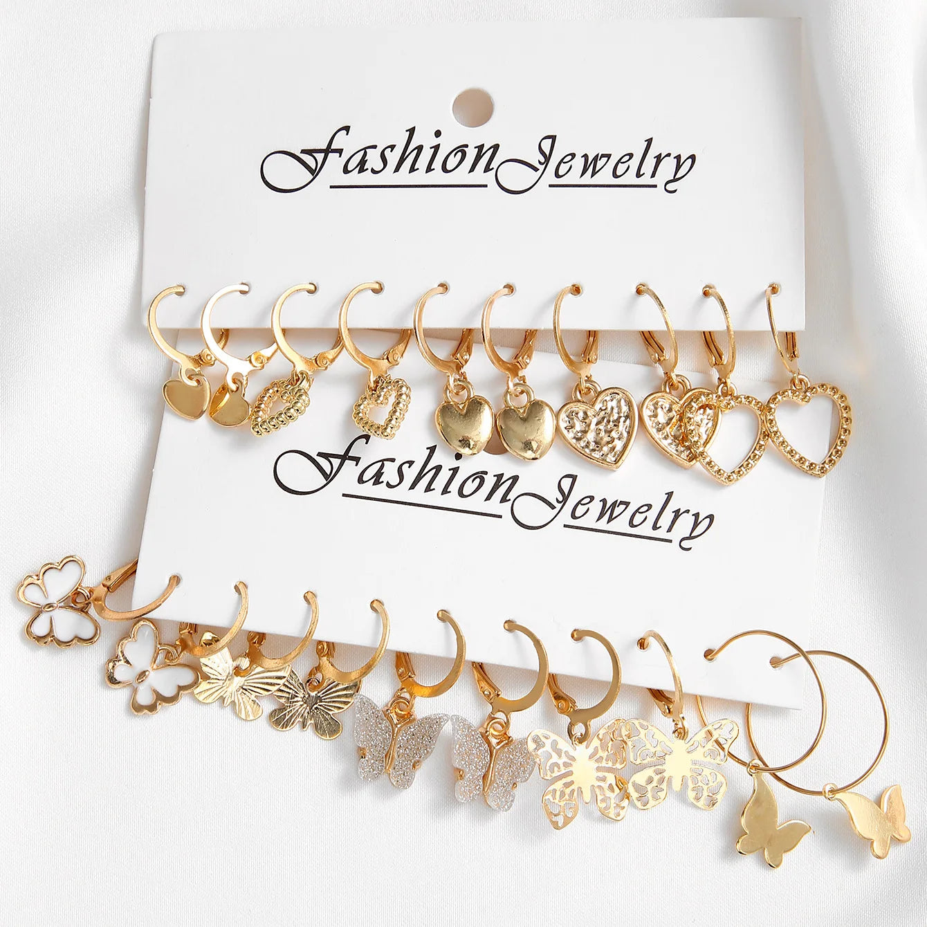 Neues Goldfarbenes Schmetterlings-Liebes-Creolen-Set, neue kreative einfache Herz-Hohl-Ohrringe für Frauen, modischer trendiger Schmuck