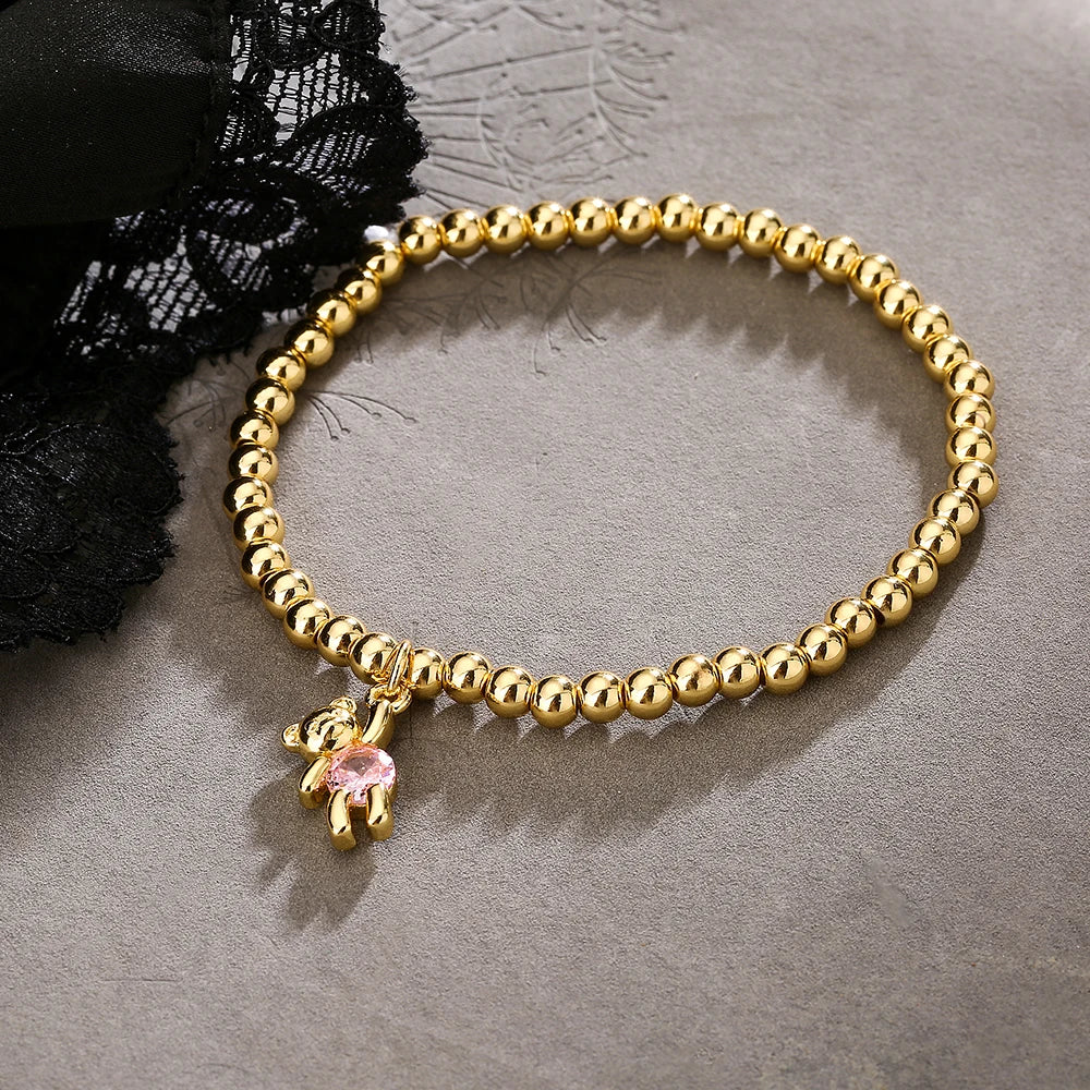 NEWBUY Trendige Goldfarbene Kupferperlen Armbänder für Frauen Weiß/Rosa/Lila Zirkonia Süße Bär Schmuck