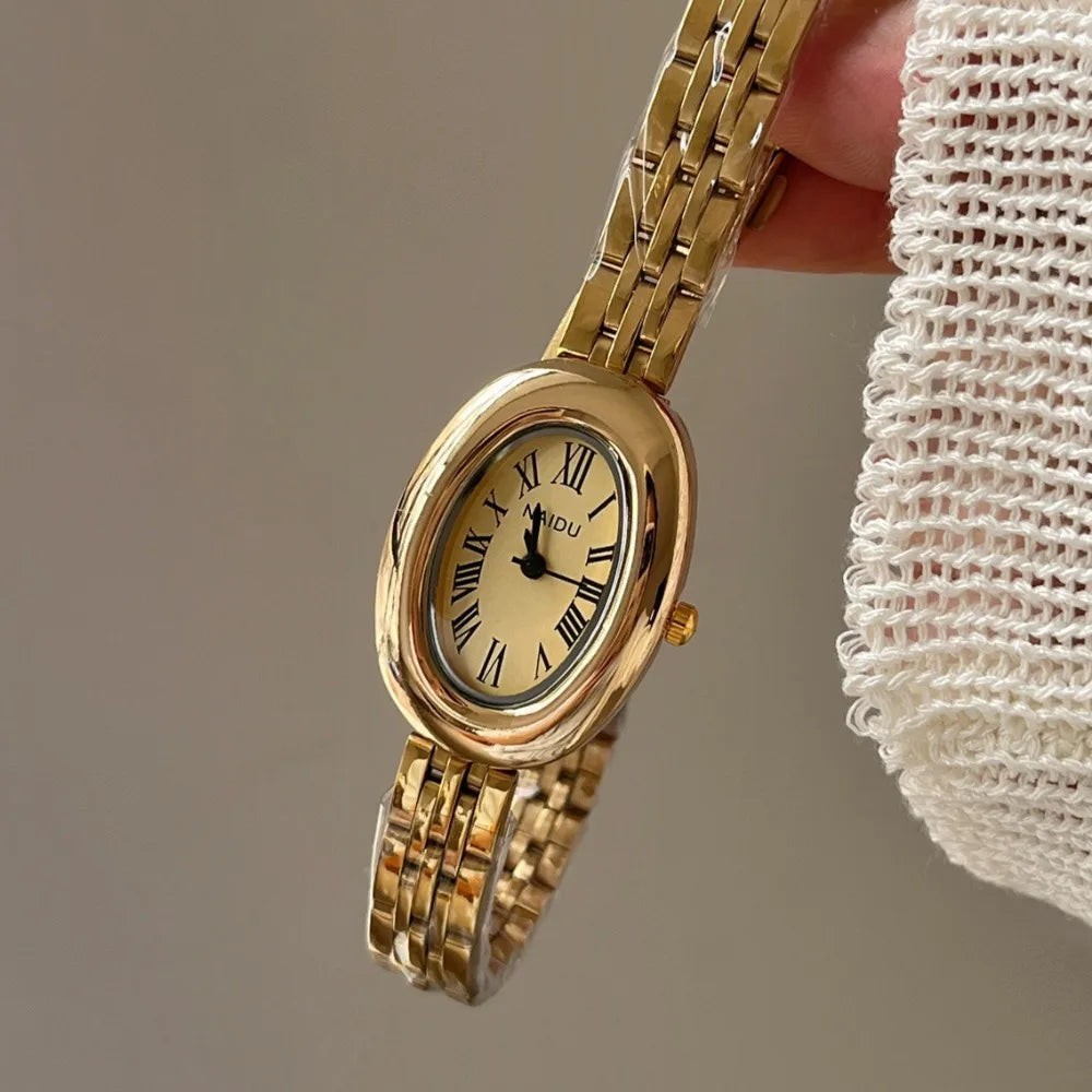 Reloj de moda Hot Sale para mujer, estilo de la antigua Roma, esfera ovalada, reloj pequeño dorado, correa de acero ajustable, reloj de pulsera de cuarzo al por mayor