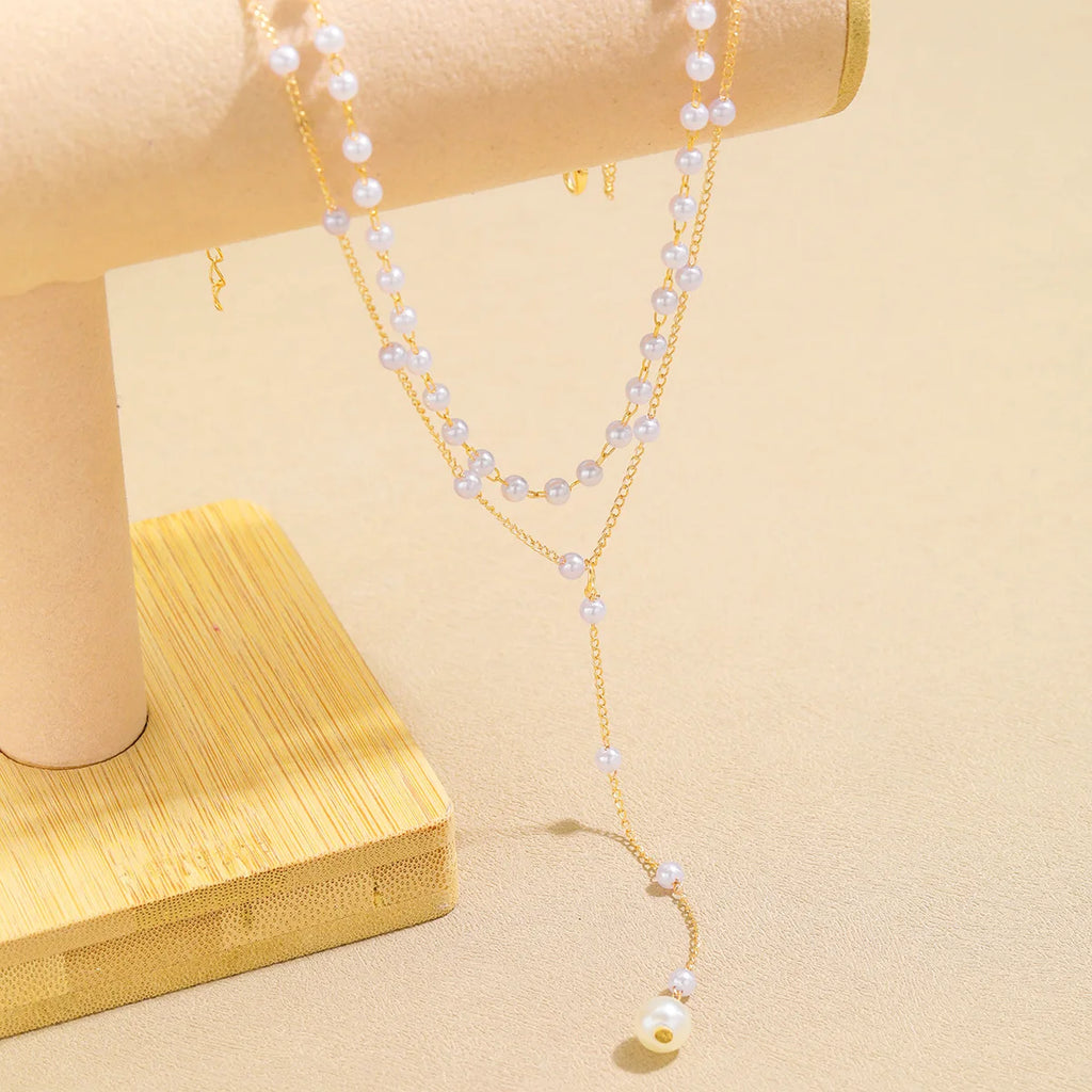 Gargantilla coreana de moda con perlas de imitación, doble capa, colgante de cuentas de bola grande, collar con borlas, joyería corporal sexy para mujer