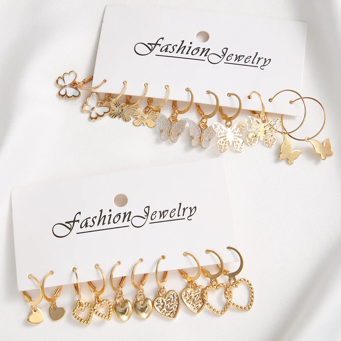 Neues Goldfarbenes Schmetterlings-Liebes-Creolen-Set, neue kreative einfache Herz-Hohl-Ohrringe für Frauen, modischer trendiger Schmuck