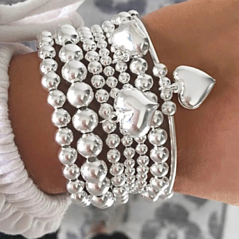 7-teiliges Set schicker Herz-Charm-Perlenarmbänder für Damen, Vintage, schlicht, silberfarben, exquisit, mehrschichtig, Armreifen, Schmuckgeschenk