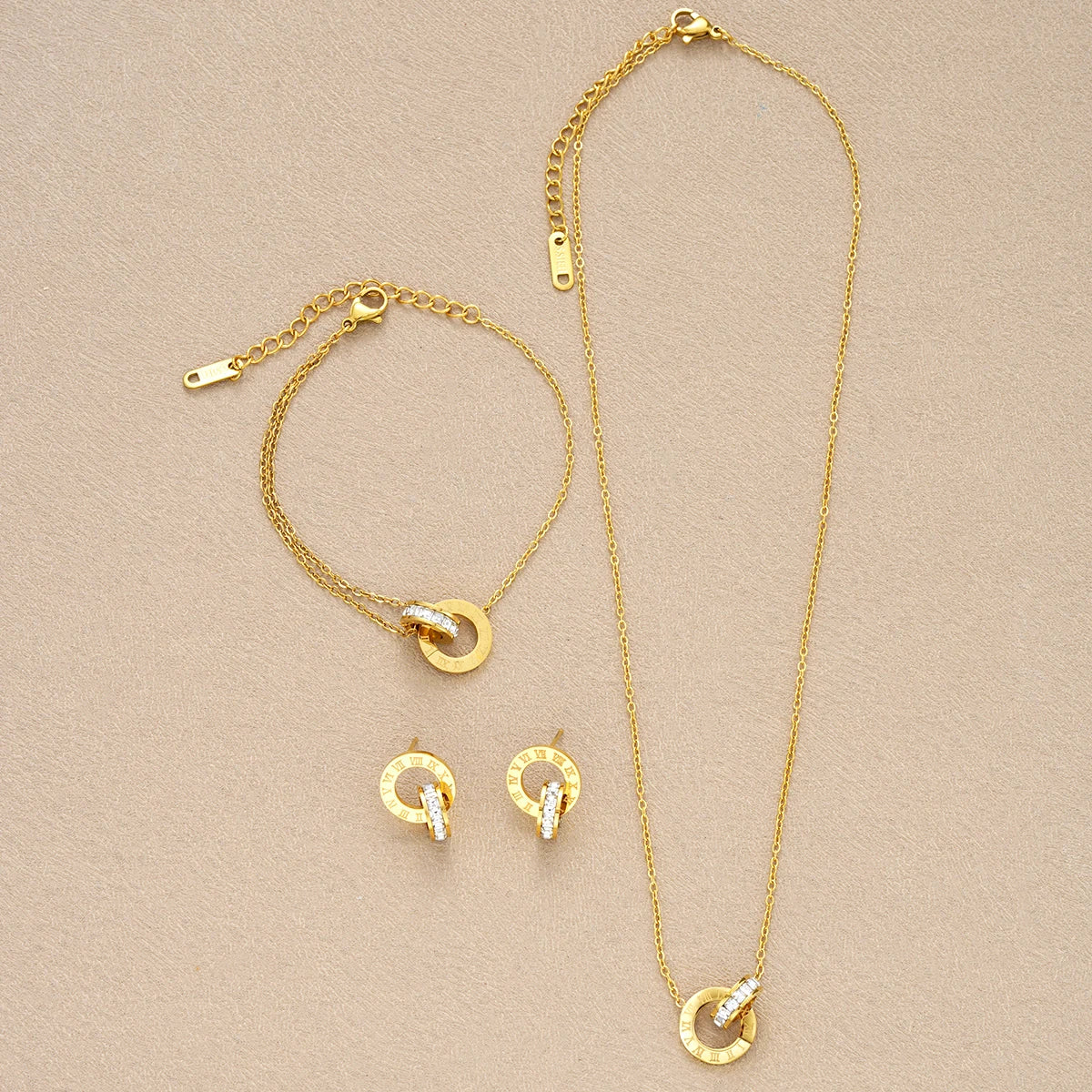 4-teiliges Set Goldfarbene Edelstahl-Kristallkette Armband Ohrringe für Frauen Ineinandergreifende Kreise Römische Ziffern Schmucksets