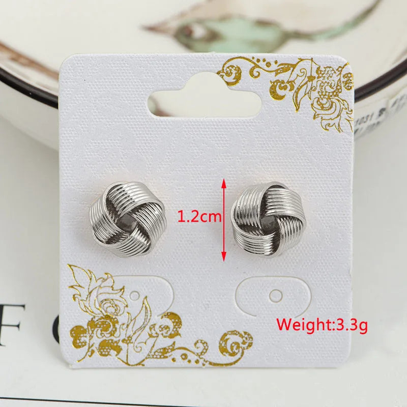 Goldfarbene Metall-Tropfenohrringe Unregelmäßige hohle Herz-Anhänger-Ohrringe Gedrehte geometrische Persönlichkeits-Ohrringe für Frauen