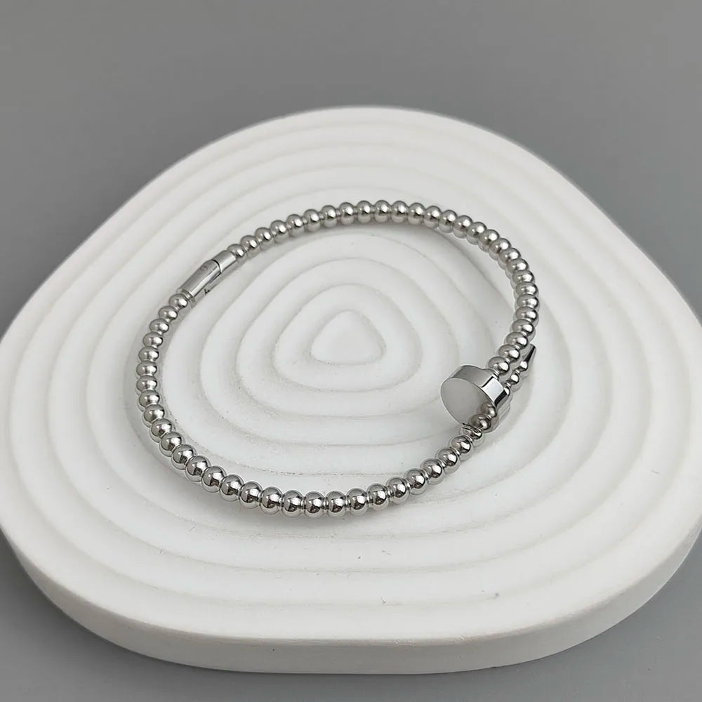 Schlichtes Armband aus rundem Perlen-Nagel, vergoldeter Edelstahl, Damenarmband, wasserdichtes und rostfreies Armband, von Paaren getragen