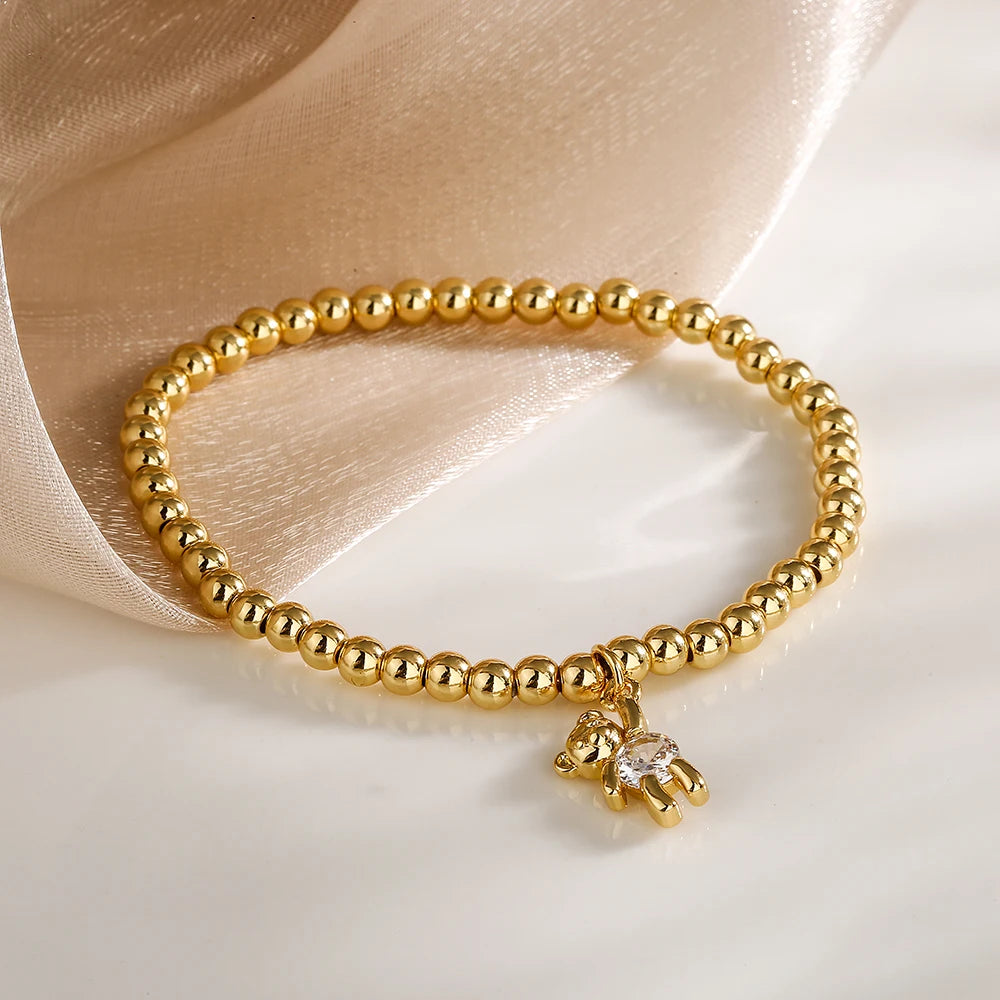 NEWBUY Trendige Goldfarbene Kupferperlen Armbänder für Frauen Weiß/Rosa/Lila Zirkonia Süße Bär Schmuck