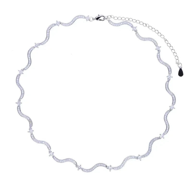 Modisches Damen-Schmuckset mit Wellenband-Armreif, Ring, Ohrringen und Halskette mit 5A Zirkonia CZ in Micro-Pavé-Fassung