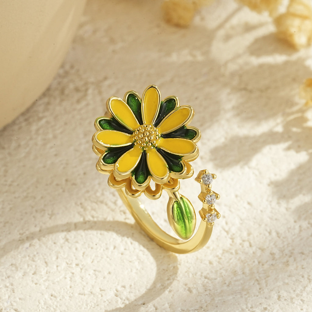 Drehbarer blumenförmiger vergoldeter Ring
