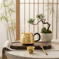 Pure 999 Fine Silver Elegant Handcrafted Gilded Pitcher Featuring Embossed Pine and Mountain Landscape with Dark Wood Handle - Handicraft