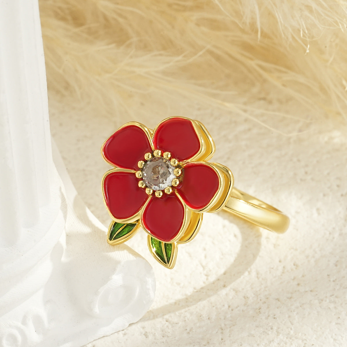 Drehbarer blumenförmiger vergoldeter Ring