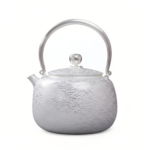 Teekanne aus feinem 999er Sterlingsilber, handgefertigt, gehämmert, mit elegantem gewölbtem Griff – Kunsthandwerk