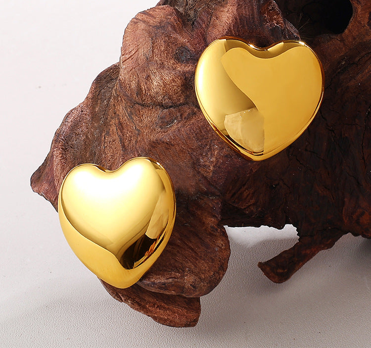 European And American Minimalist Glossy Heart-shaped Stainless Steel Earrings For Women. Light Luxury Minimalist Style. Exaggerated Heart-shaped Earrings. Versatile Accessories.